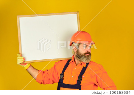 Plan repair works. Architect showing project. Professional repairman. Visual outline. Troubleshoot concept. Bearded man repairman builder. Repairman hold whiteboard copy space. Handsome repairman 100168684