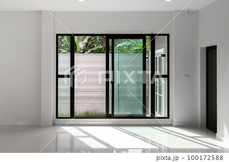 Sliding black stainless steel glass doors inside the house. 100172588