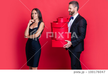 positive valentine couple in love at studio. valentine couple in love on background. 100176047