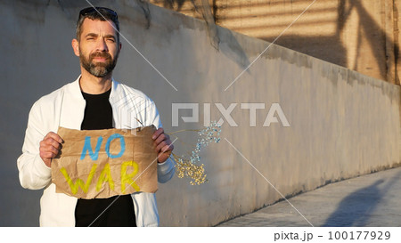 War of Russia against Ukraine. Ukrainian man asks to stop the war in Ukraine. Man with message Stop War. 100177929