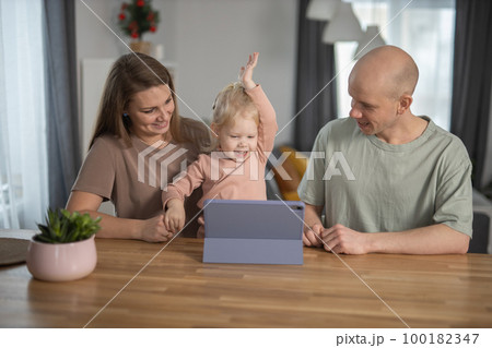 Deaf child girl with cochlear implant studying to hear sounds and have fun with mother and father - recovery after cochlear Implant surgery and rehabilitation concept Deaf child girl with cochlear implant studying to hear sounds and have fun with mother and father - recovery after cochlear Implant surgery and rehabilitation concept 100182347