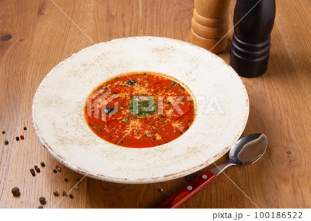 Tomato and seafood creamy soup with shrimps. Tomato and seafood creamy soup with shrimps. 100186522