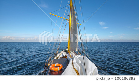 Sailing old schooner on a beautiful sunny day. 100186893