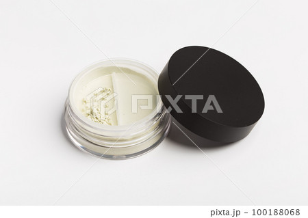 Green cosmetic mineral powder for face on container with twist seal sifter - top view isolated on white background Green cosmetic mineral powder for face on container with twist seal sifter - top view isolated on white background 100188068