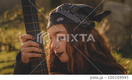 teenage woman with guitar teenage woman with guitar 100189995