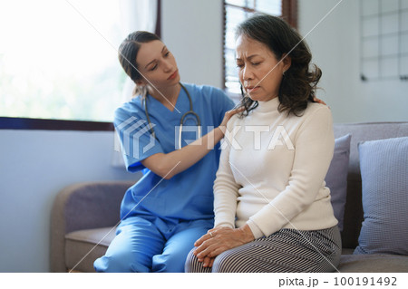 Portrait of a female doctor holding a patient's hand to encourage the fight against disease Portrait of a female doctor holding a patient's hand to encourage the fight against disease 100191492