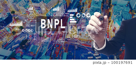 BNPL - Buy Now Pay Later theme with businessman in city at night BNPL - Buy Now Pay Later theme with businessman in city at night 100197691