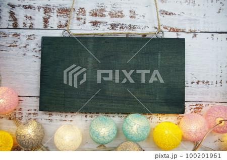 Empty space for copy with LED cotton balls decoration on wooden background 100201961