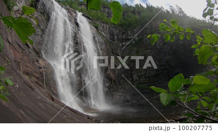 Waterfall in mountains. Outdoor nature in Norway 100207775