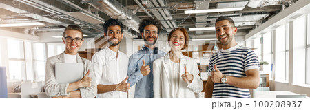 Diverse group of colleagues enjoying working together in an office. Teamwork concept Diverse group of colleagues enjoying working together in an office. Teamwork concept 100208937
