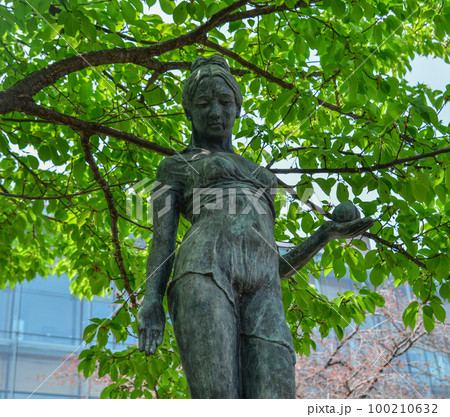 Ancient bronze god statue at the park 100210632