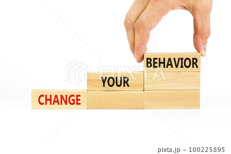 Motivation and Change your behavior symbol. Concept words Change your behavior on wooden block on a beautiful white table white background. Business change your behavior concept. Copy space. 100225895