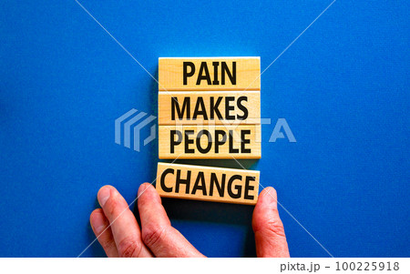 Pain makes people change symbol. Concept words Pain makes people change on wooden blocks on a beautiful blue table blue background. Business, motivational and pain makes people change concept. Pain makes people change symbol. Concept words Pain makes people change on wooden blocks on a beautiful blue table blue background. Business, motivational and pain makes people change concept. 100225918