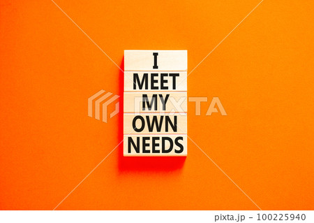 I meet my own needs symbol. Concept words I meet my own needs on wooden blocks. Beautiful orange table orange background. Business and i meet my own needs concept. Copy space. 100225940