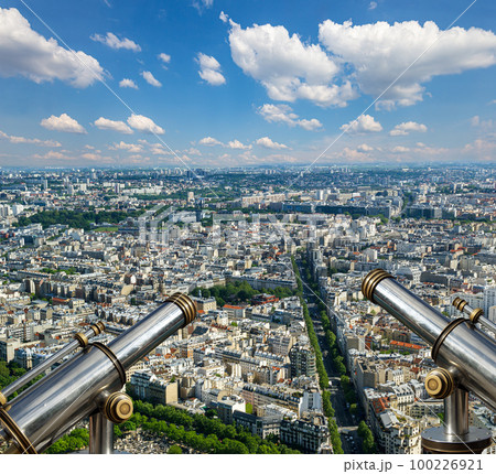 Telescope viewer and city skyline at daytime (against the background of very beautiful clouds). Paris, France. 100226921