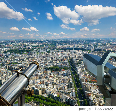 Telescope viewer and city skyline at daytime (against the background of very beautiful clouds). Paris, France. Telescope viewer and city skyline at daytime (against the background of very beautiful clouds). Paris, France. 100226922