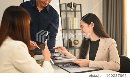 Team of professional business people discussing company financial project together during meeting on modern office Team of professional business people discussing company financial project together during meeting on modern office 100227063