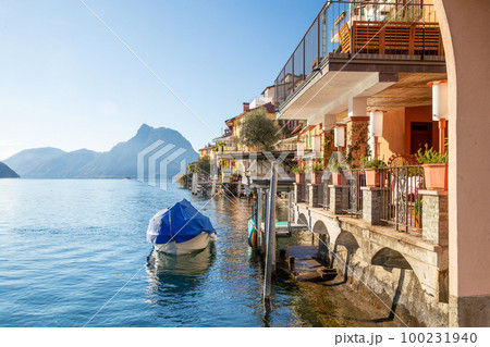 Gandria  village  in Lugano suburb - sheltered boat and houses next  to water 100231940