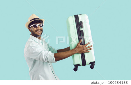 Smiling Indian man excited about summer travel Smiling Indian man excited about summer travel 100234188