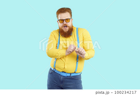 Funny cool stylish bearded fat man dancing victory dance isolated on light blue background. Funny cool stylish bearded fat man dancing victory dance isolated on light blue background. 100234217