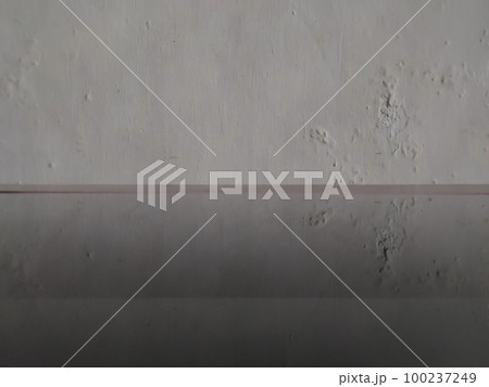 white wall background with glass table 100237249