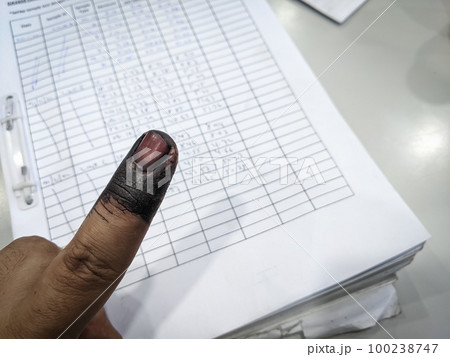 Index finger with indelible ink stain after voting in election 100238747