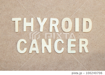 Wood alphabet letter in word thyroid cancer on wood background Wood alphabet letter in word thyroid cancer on wood background 100240706