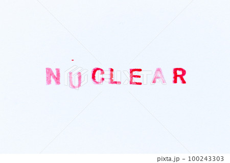 Red color ink rubber stamp in word nuclear on white paper background Red color ink rubber stamp in word nuclear on white paper background 100243303