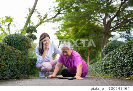 Asian senior woman fell down on lying floor because faint and limb weakness and Crying in pain form accident and her daughter came to help support. Concept of old elderly insurance and health care Asian senior woman fell down on lying floor because faint and limb weakness and Crying in pain form accident and her daughter came to help support. Concept of old elderly insurance and health care 100245464
