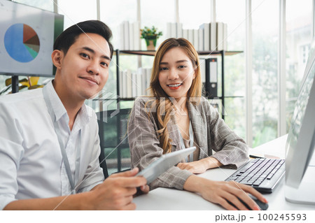 Successful team of new business startup people working together in creative office, happy euphoric proud Asian male and female professional winner feel overjoyed 100245593