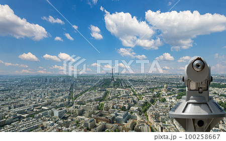 Telescope viewer and city skyline at daytime (against the background of very beautiful clouds). Paris, France. Telescope viewer and city skyline at daytime (against the background of very beautiful clouds). Paris, France. 100258667