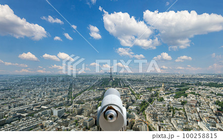 Telescope viewer and city skyline at daytime (against the background of very beautiful clouds). Paris, France. Telescope viewer and city skyline at daytime (against the background of very beautiful clouds). Paris, France. 100258815