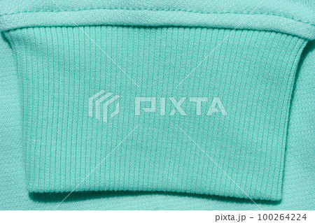 Mint cotton sweater sleeve, close up Mint cotton sweater sleeve, close up 100264224
