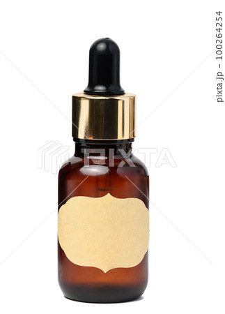 A glass brown bottle with a dropper on a white isolated background, a container for cosmetic products 100264254