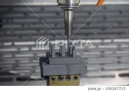 The CNC milling machine finish cutting the graphite electrode parts with solid ball end mill. The CNC milling machine finish cutting the graphite electrode parts with solid ball end mill. 100267725