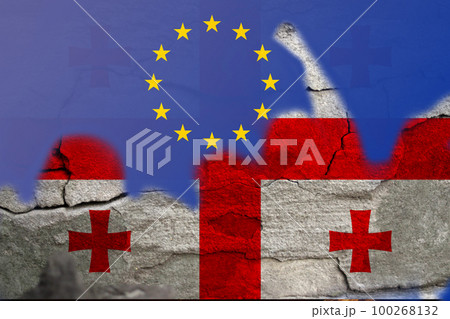 European Union flag Georgia protest. Conflict war over border. Support. Georgia flag. Woman low rights. Male hands. Authoritarian law. Foreign agents. Police. Out of focus 100268132
