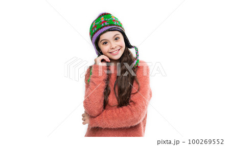 winter fashion for smiling teen girl. warm hat knitwear. teen girl model in warm hat. teen girl 100269552