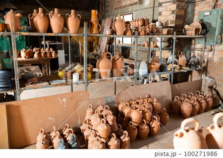 Pottery products on racks in workshop Pottery products on racks in workshop 100271986
