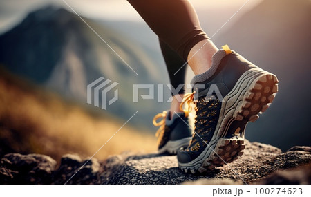 Athletic pair of female legs in running shoes on trail. Young attractive woman walking or hiking in forest or park, preparing for sprint or marathon. Athletic pair of female legs in running shoes on trail. Young attractive woman walking or hiking in forest or park, preparing for sprint or marathon. 100274623