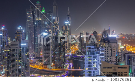 View of various skyscrapers in tallest recidential block in Dubai Marina aerial all night timelapse View of various skyscrapers in tallest recidential block in Dubai Marina aerial all night timelapse 100276861