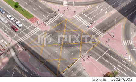 Bussy traffic on the road intersection in Dubai business bay district aerial timelapse, UAE Bussy traffic on the road intersection in Dubai business bay district aerial timelapse, UAE 100276905