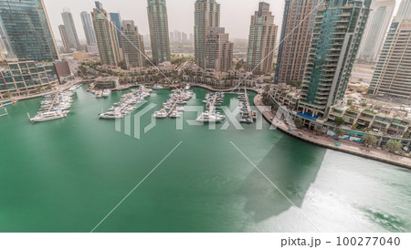 Luxury yacht bay in the city aerial timelapse in Dubai marina 100277040