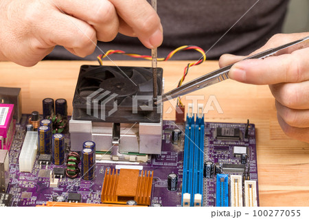 Electric circuit. High technology. Installation of a computer processor radiator fan Electric circuit. High technology. Installation of a computer processor radiator fan 100277055