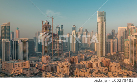 Dubai's business bay towers aerial morning timelapse. Rooftop view of some skyscrapers Dubai's business bay towers aerial morning timelapse. Rooftop view of some skyscrapers 100278483