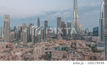Dubai Downtown night to day timelapse with tallest skyscraper and other towers Dubai Downtown night to day timelapse with tallest skyscraper and other towers 100278498