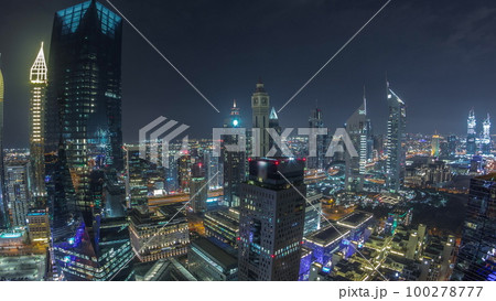 Panorama of futuristic skyscrapers in financial district business center in Dubai night timelapse 100278777