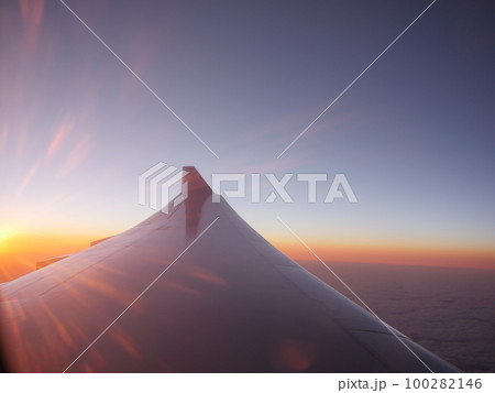 Airplane wing at sunset 100282146