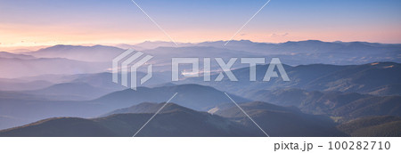 Amazing silhouettes of a mountains at colorful sunset in summer Amazing silhouettes of a mountains at colorful sunset in summer 100282710