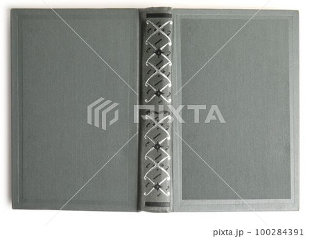 Open old book with vintage light grey cover isolated on white, top view Open old book with vintage light grey cover isolated on white, top view 100284391