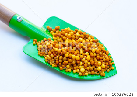 Yellow fertilizer plant food. High NPK 100286022